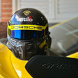 Porsche helmet on a yellow car with 'Stilo' branding